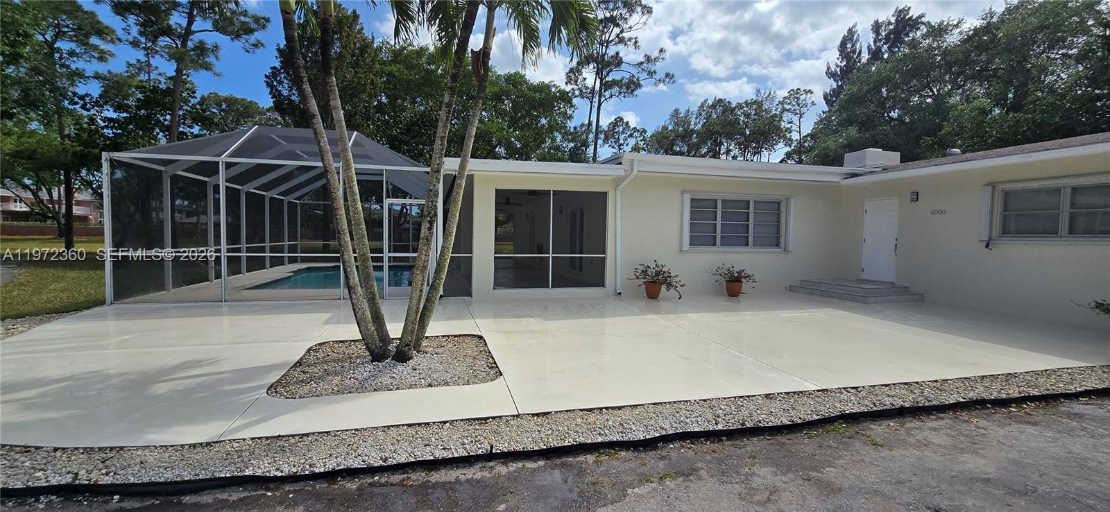 6500 Southwest 82nd Avenue Miami, FL 33143 - Photo 44 of 54 a view of a house with backyard and porch