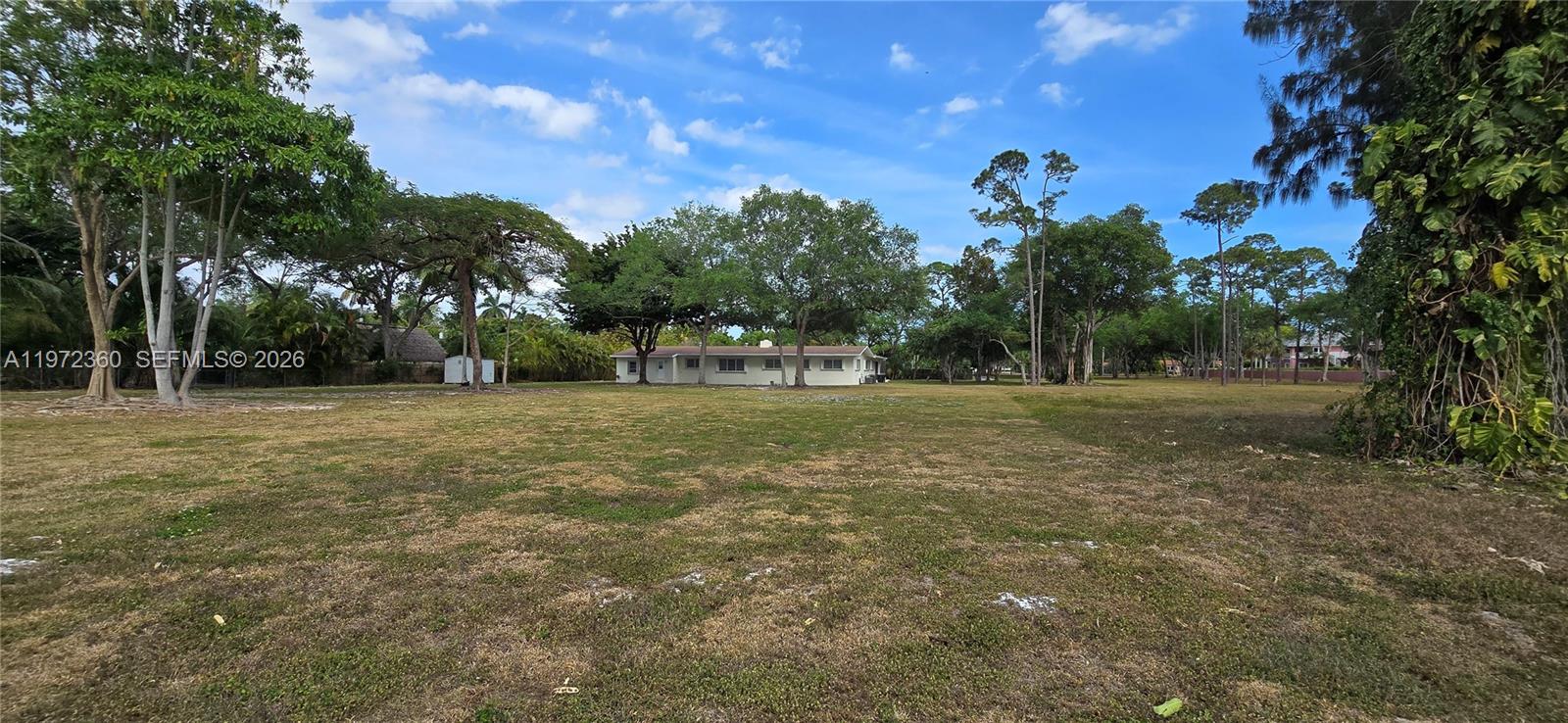 6500 Southwest 82nd Avenue Miami, FL 33143 - Photo 49 of 54 a view of a field with trees in the background