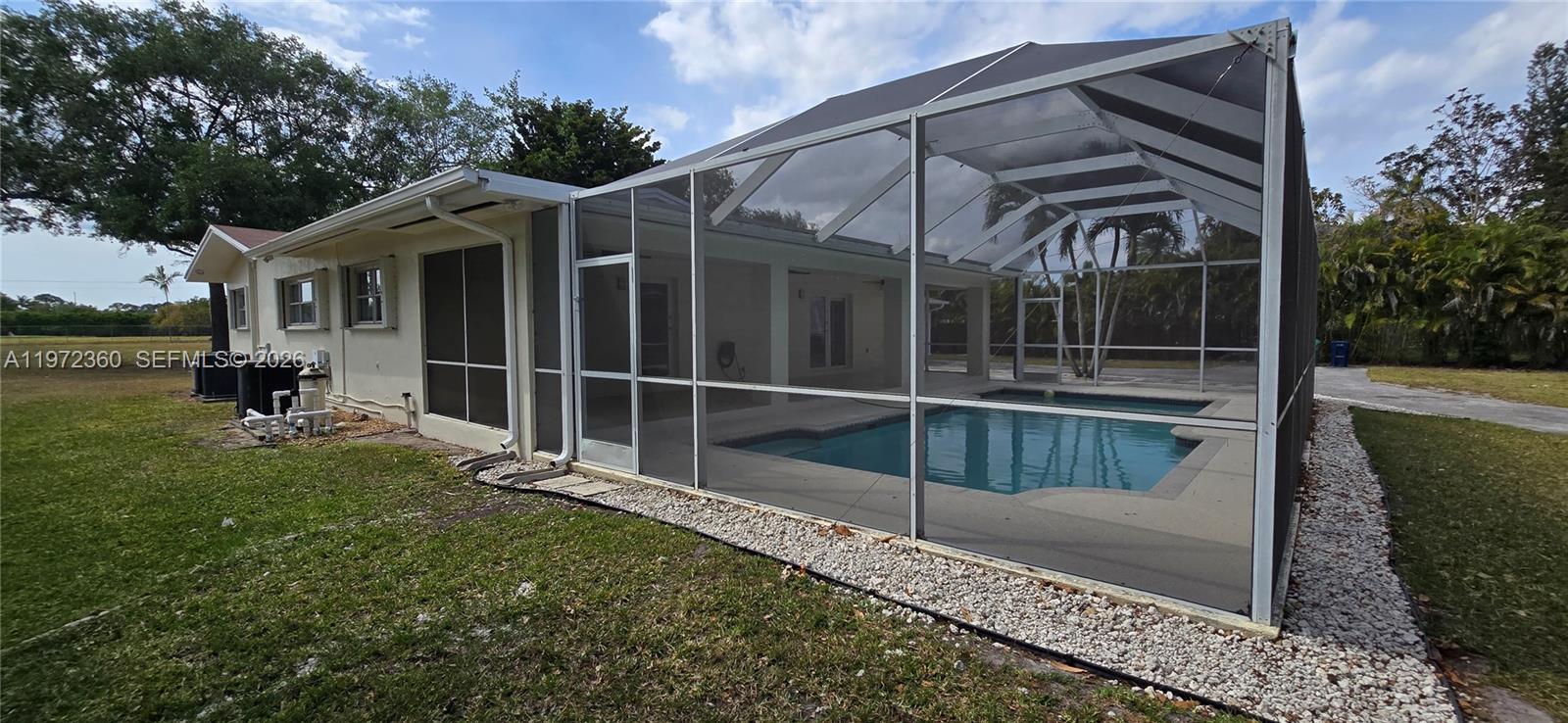 6500 Southwest 82nd Avenue Miami, FL 33143 - Photo 52 of 54 a view of a house with backyard and porch