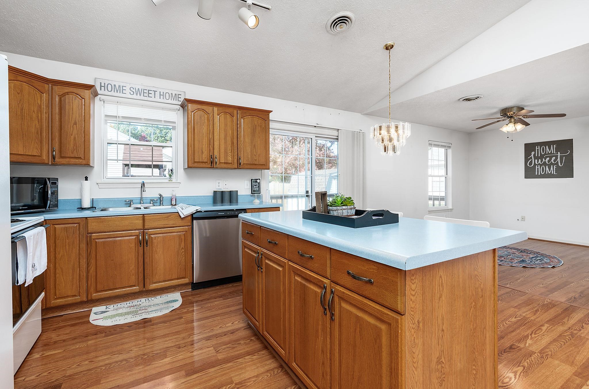 300 Robinhood Road Staunton, VA 24401 - Photo 11 of 51 a kitchen with stainless steel appliances granite countertop a sink window and cabinets