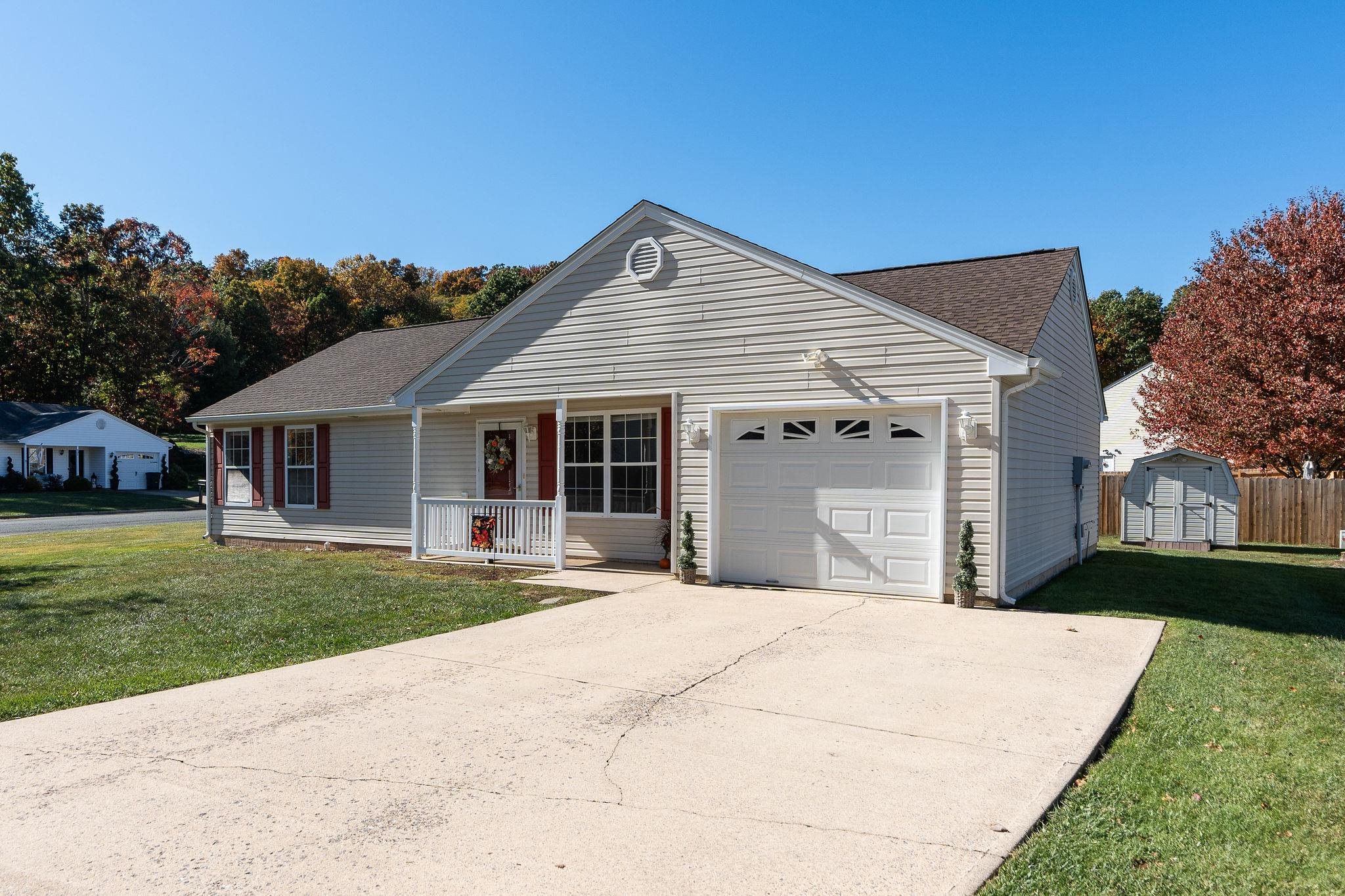 300 Robinhood Road Staunton, VA 24401 - Photo 44 of 51 a front view of a house with a yard and garage