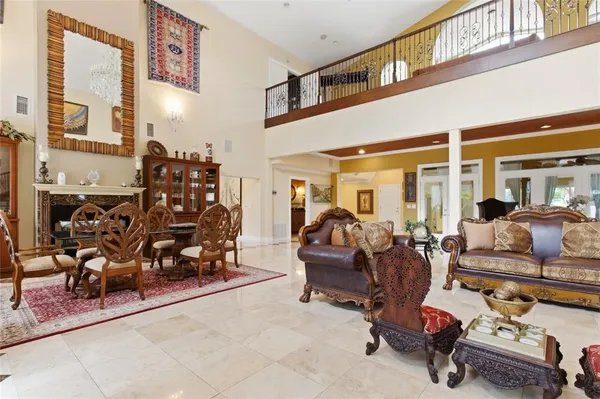 a kitchen with a sink a counter top space stainless steel appliances a large window and cabinets