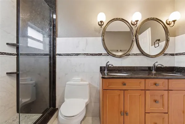 a kitchen with a refrigerator a sink and cabinets