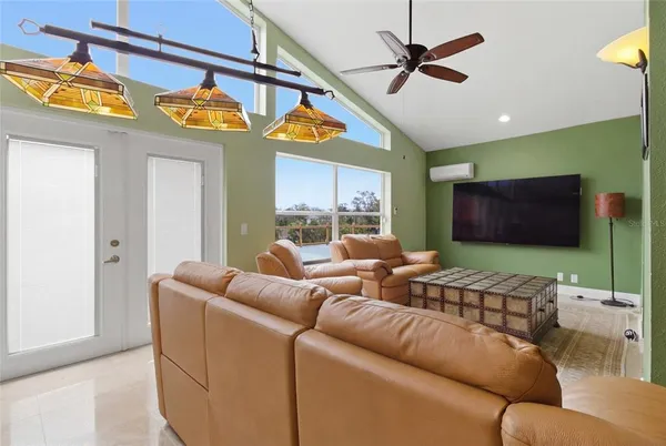 a living room with furniture and a large window