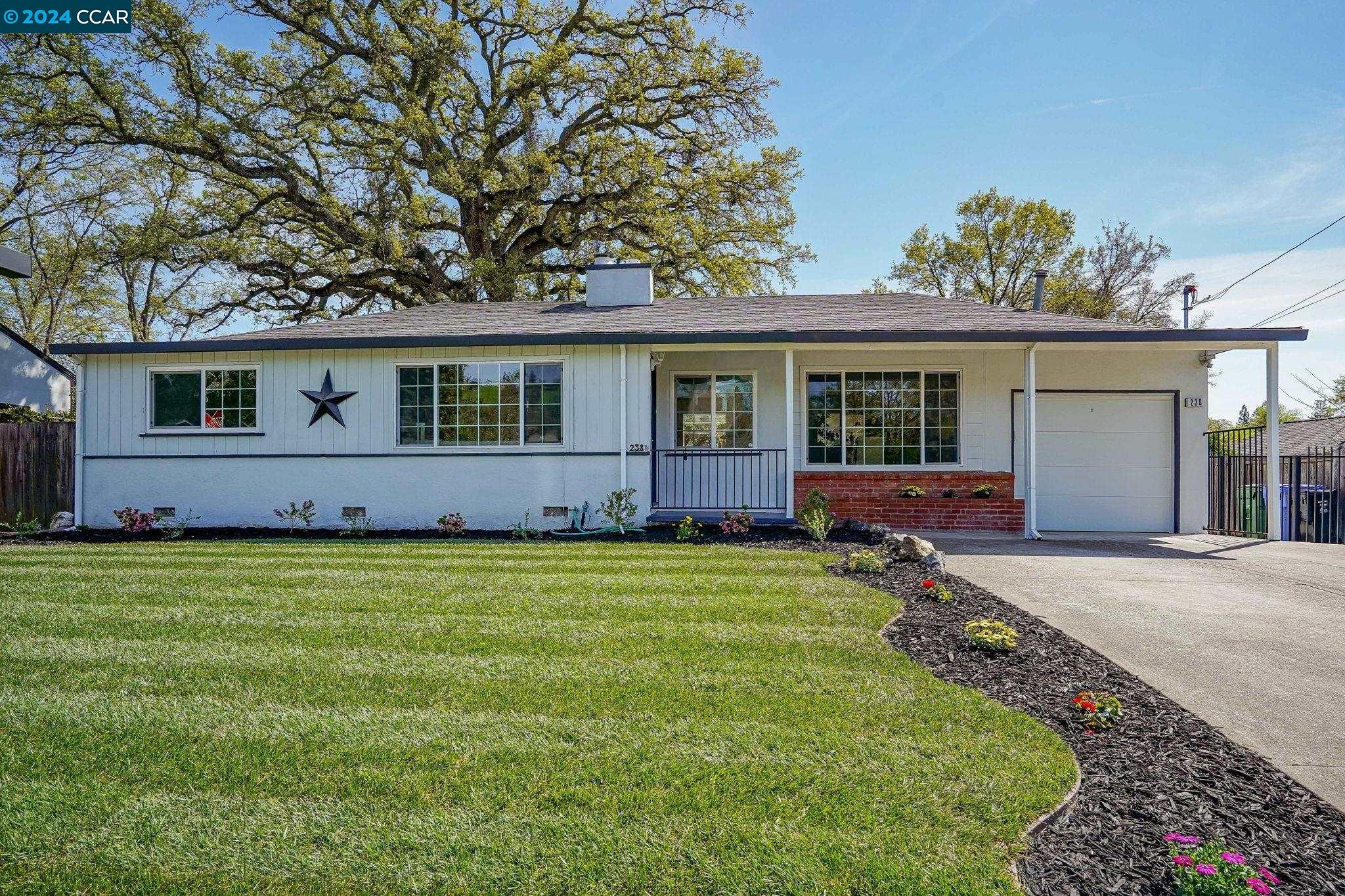 front view of a house with a yard