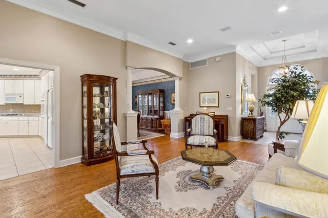 a view of a dining room with furniture and chandelier