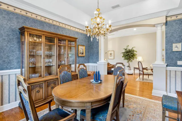 a kitchen with white cabinets and appliances