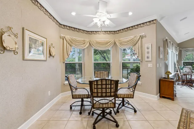 a living room with furniture fireplace and a large window