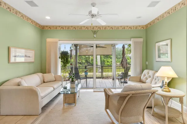 a view of a water pond with green field