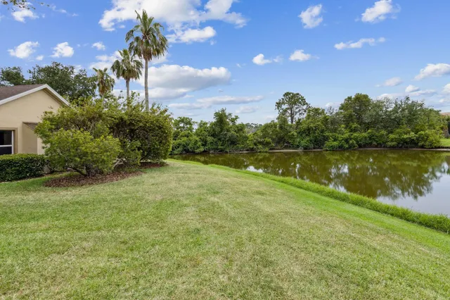 a bedroom with furniture and a chandelier
