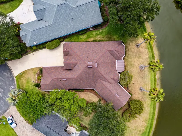 a view of a hallway with closet and a bathroom