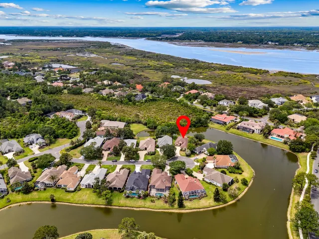 a white bath tub sitting next to a shower