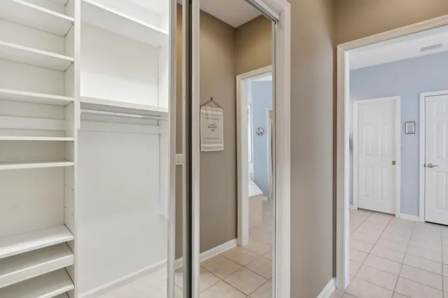 a room with a sink and a stove top oven