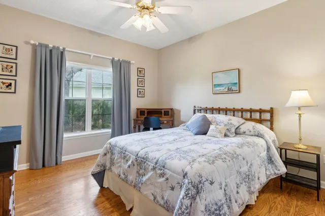 a view of a house with a swimming pool and porch with furniture