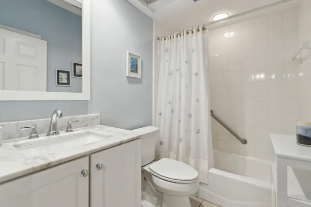 a view of a lake with houses in the back