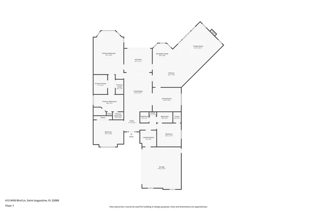 a living room with furniture a rug and a lamp