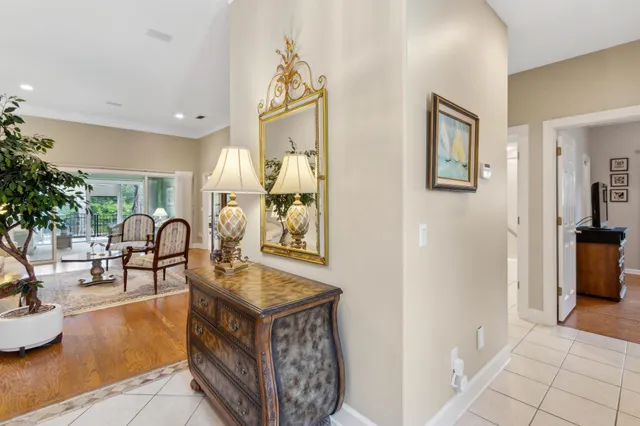 a living room with furniture a table and wooden floor