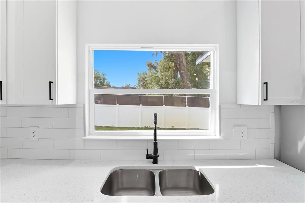 6716 East Crimson Lane Inverness, FL 34452 - Photo 16 of 44 a kitchen with a sink and a window