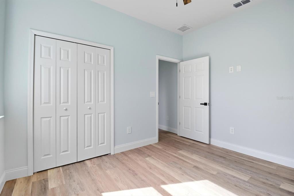 6716 East Crimson Lane Inverness, FL 34452 - Photo 33 of 44 a view of an empty room with wooden floor