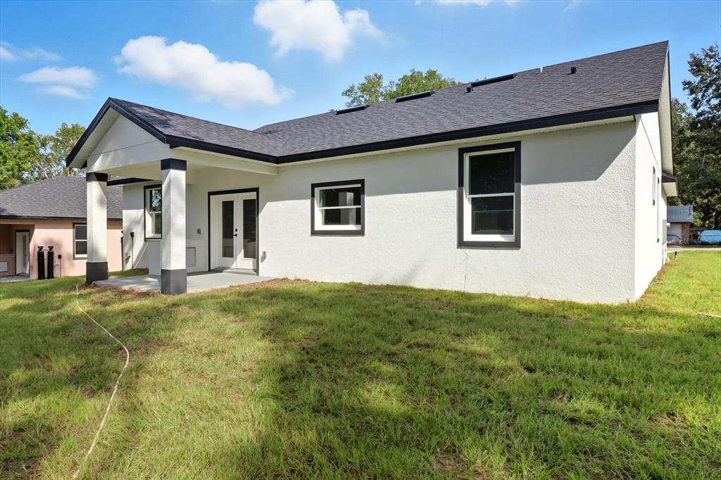 6716 East Crimson Lane Inverness, FL 34452 - Photo 37 of 44 a view of a house with a backyard