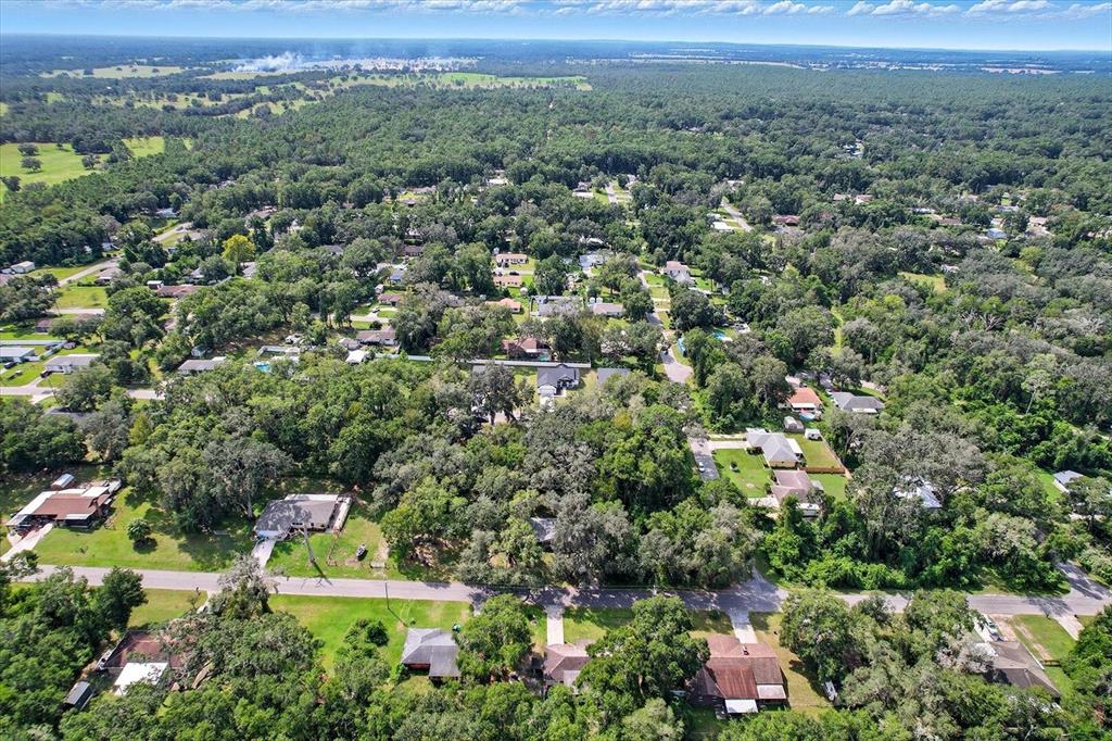 6716 East Crimson Lane Inverness, FL 34452 - Photo 42 of 44 an aerial view of a houses with a yard