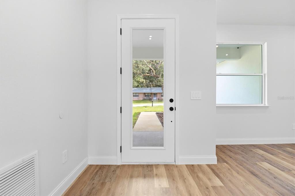 6716 East Crimson Lane Inverness, FL 34452 - Photo 8 of 44 a view of empty room with wooden floor