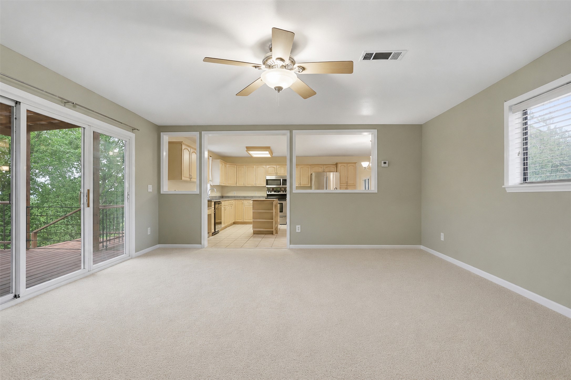27600 Ranch To Market 1431 Marble Falls, TX 78654 - Photo 10 of 33 Ceiling Fan Natural Light and a Look toward Kitchen