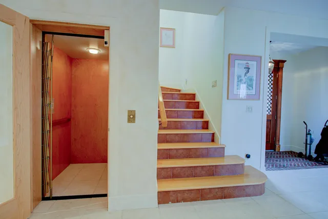 a kitchen with stainless steel appliances white cabinets and a sink