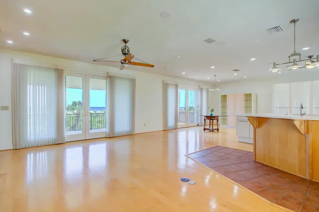 a kitchen with white cabinets and a sink