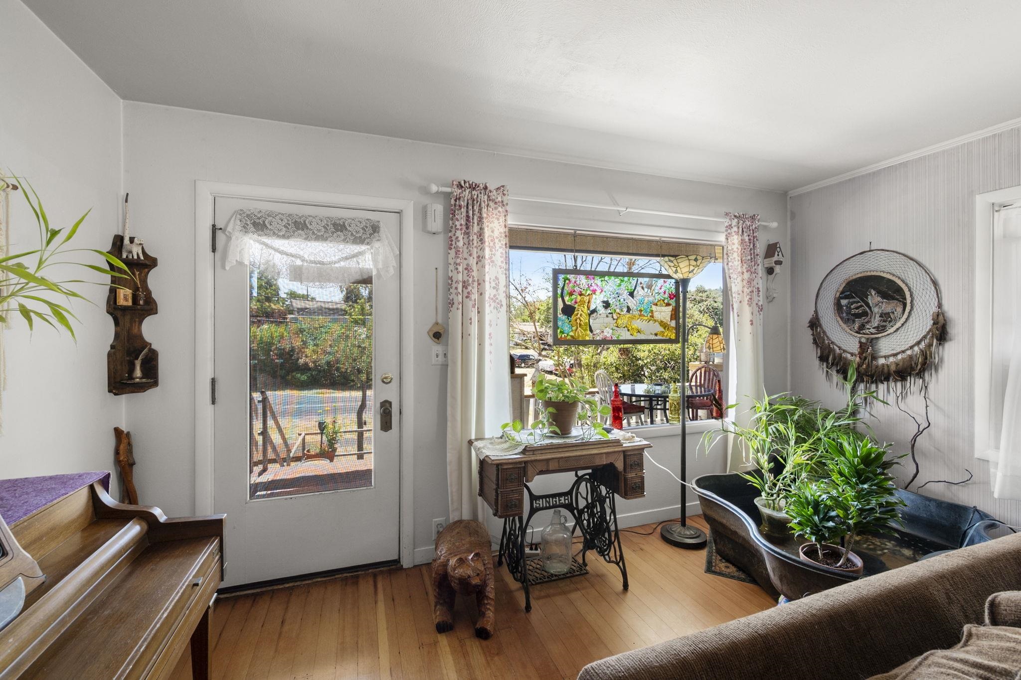 213 Main Street San Andreas, CA 95249 - Photo 11 of 53 a living room with furniture and a window