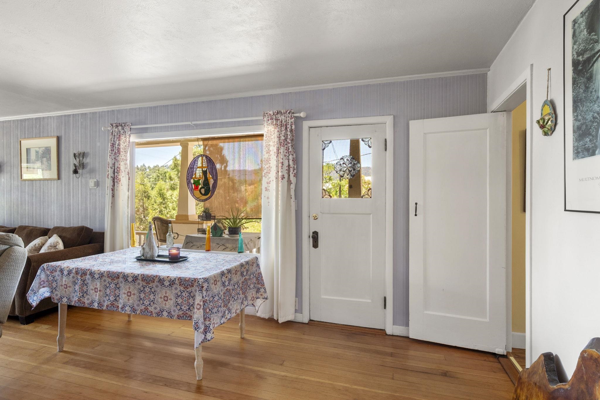 213 Main Street San Andreas, CA 95249 - Photo 16 of 53 a bedroom with a bed and wooden floor