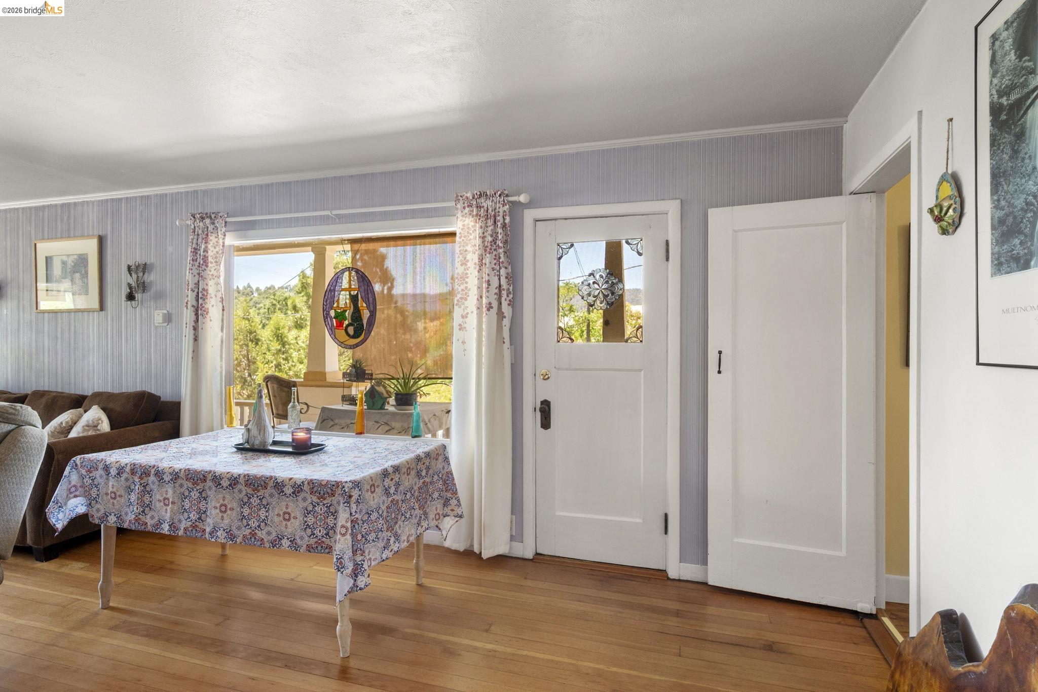 213 Main Street San Andreas, CA 95249 - Photo 16 of 55 a bedroom with a bed and wooden floor