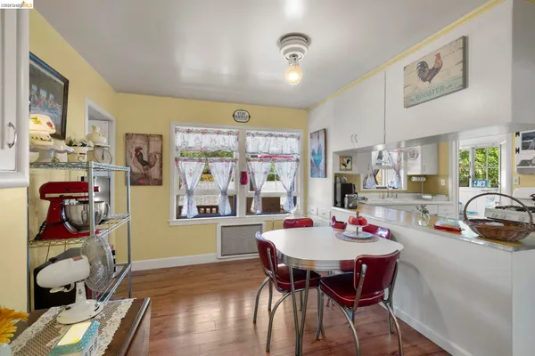 a view of a dining room with furniture and chandelier