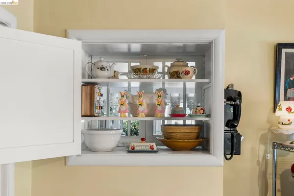 a room with toys and potted plants on a table