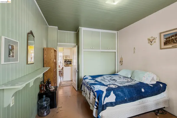 a bedroom with furniture and a window