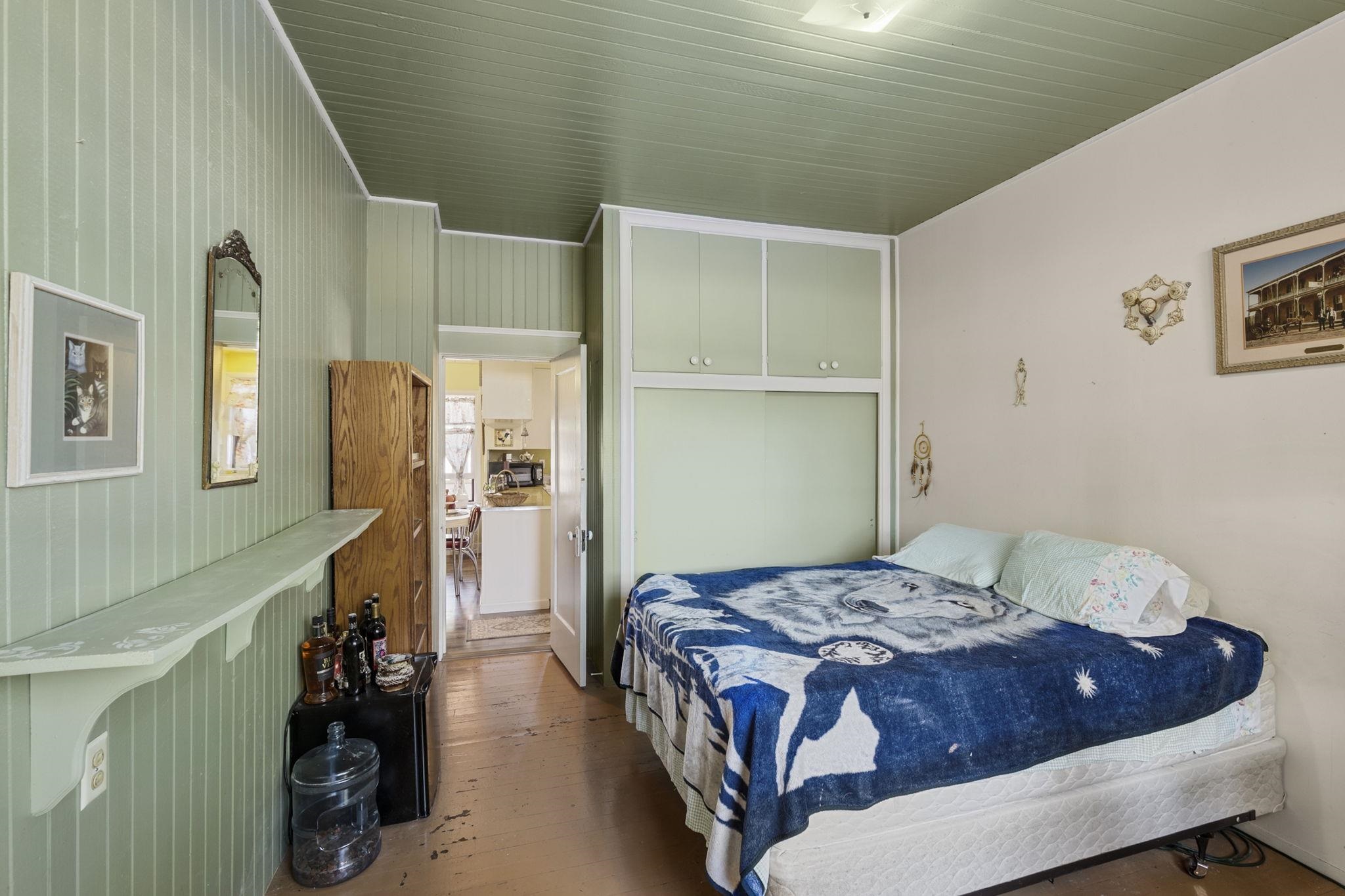 213 Main Street San Andreas, CA 95249 - Photo 34 of 53 a bedroom with a bed and a large mirror on the dresser