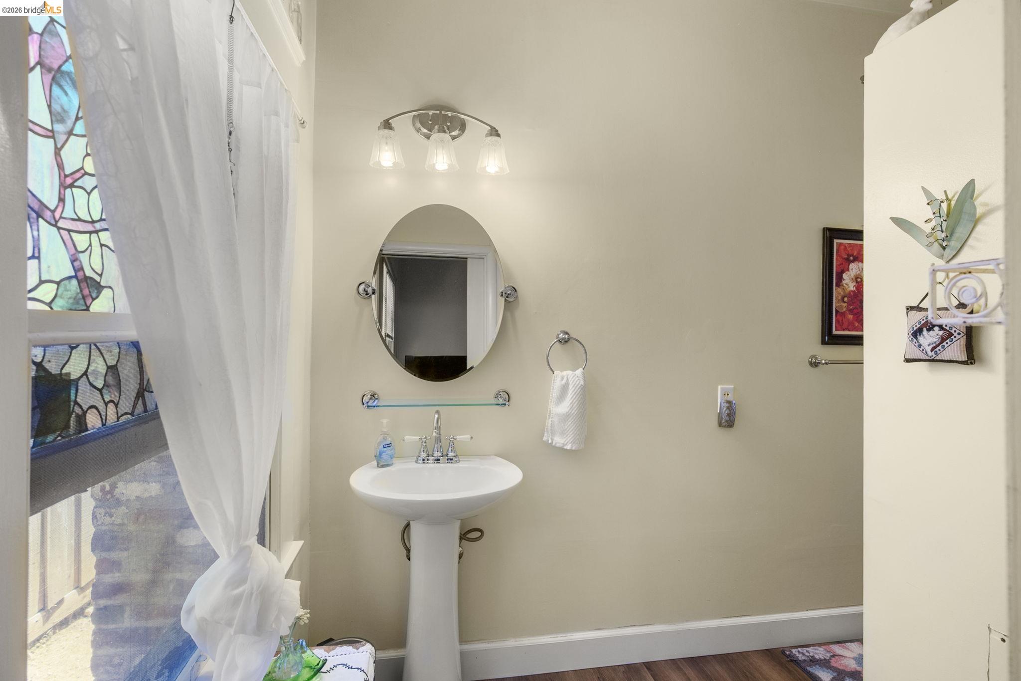 213 Main Street San Andreas, CA 95249 - Photo 36 of 55 a bathroom with a sink and mirror