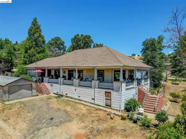 aerial view of a house with a yard