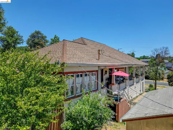 a view of a backyard with a patio