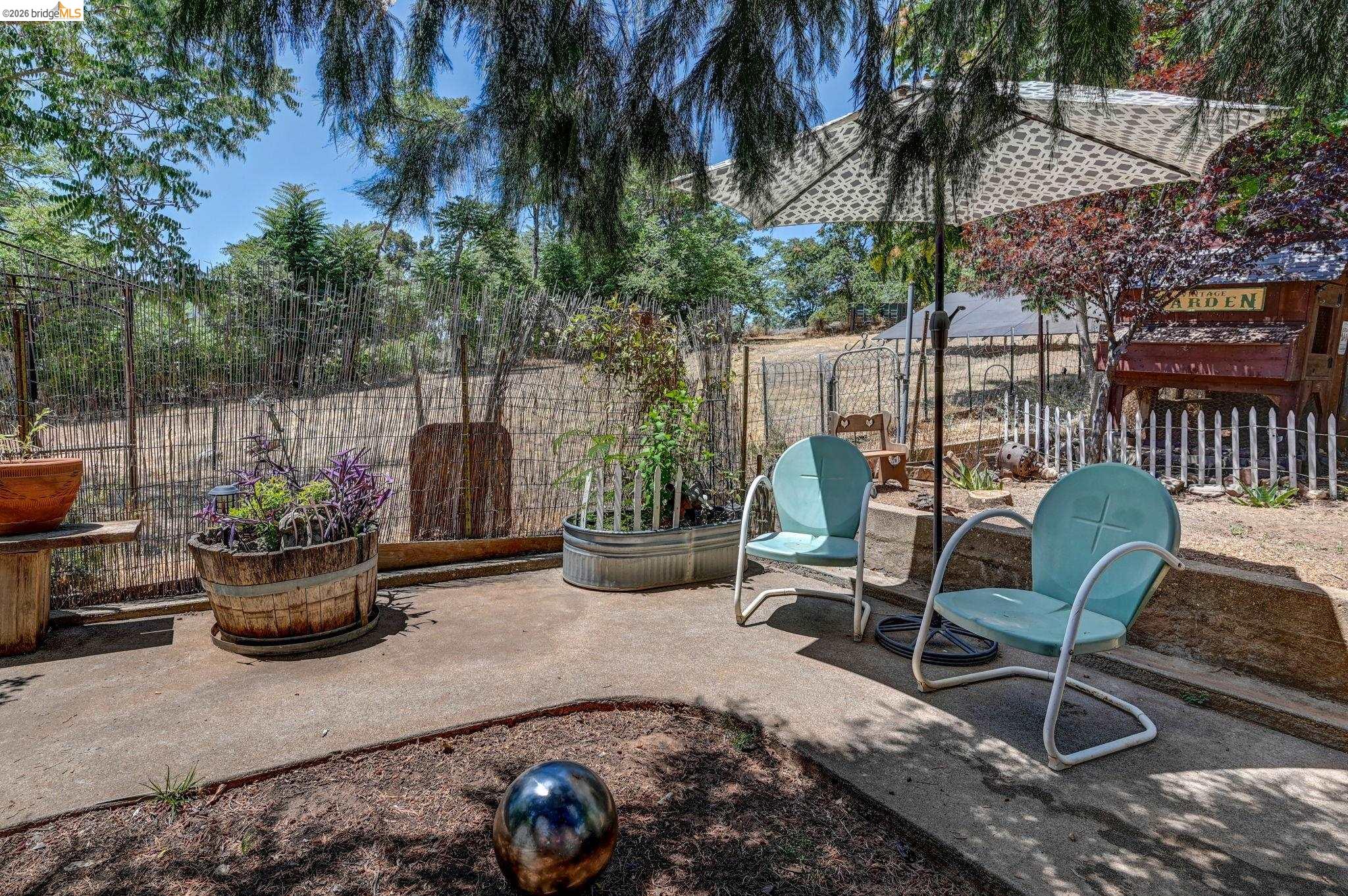 213 Main Street San Andreas, CA 95249 - Photo 47 of 55 a view of a chair and tables in the patio