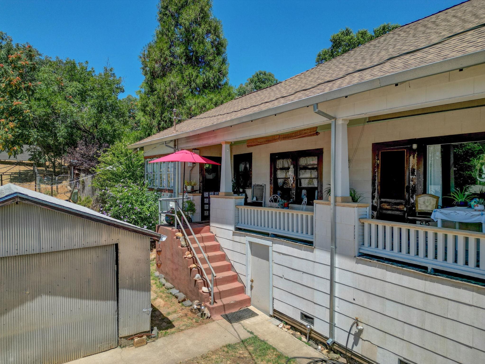 213 Main Street San Andreas, CA 95249 - Photo 5 of 53 a view of a chairs and table in the balcony