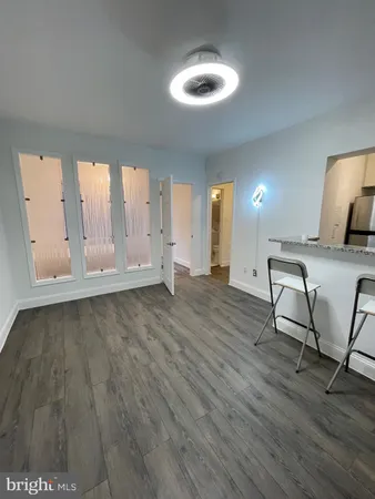 a view of a livingroom with furniture nad wooden floor