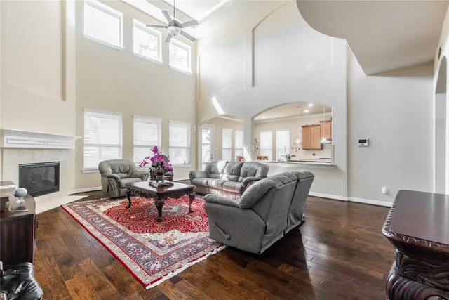 a living room with furniture fireplace and a table