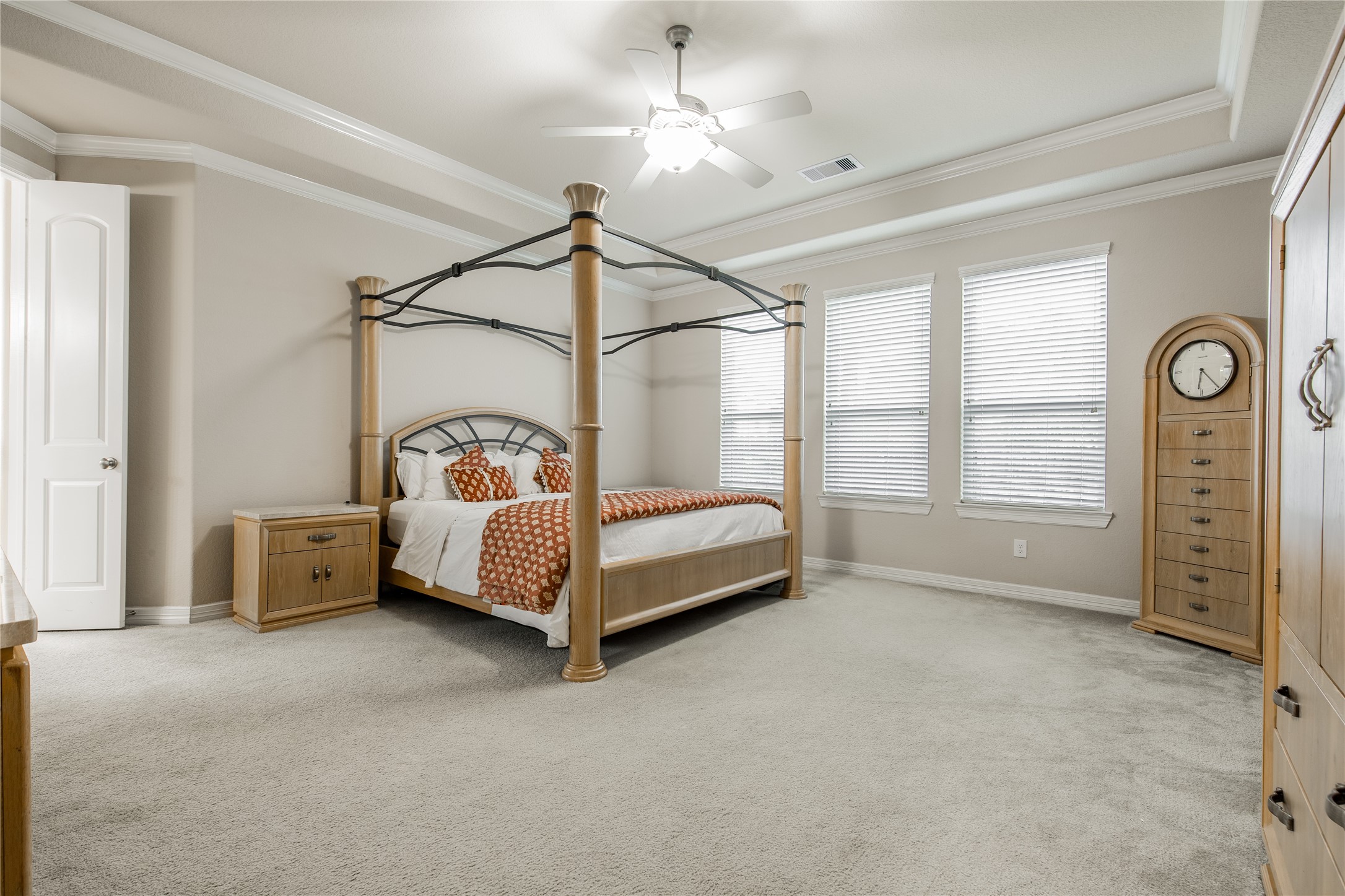 2607 Tree Swallow Bluff Path Spring, TX 77389 - Photo 17 of 50 a bedroom with a bed a chandelier and a window