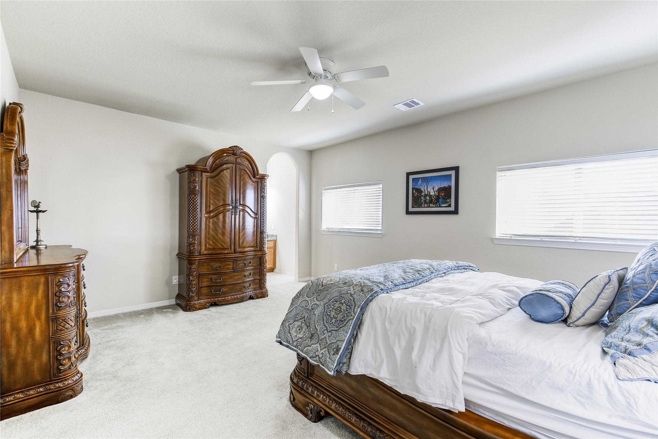 2607 Tree Swallow Bluff Path Spring, TX 77389 - Photo 28 of 50 a bedroom with a bed and a chandelier