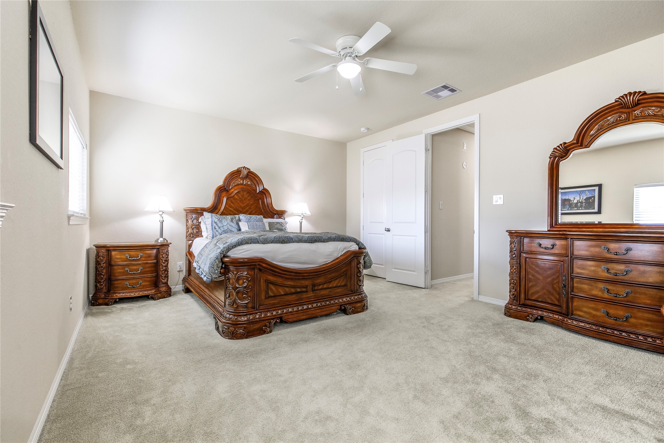 2607 Tree Swallow Bluff Path Spring, TX 77389 - Photo 29 of 50 a bedroom with a bed and a dresser