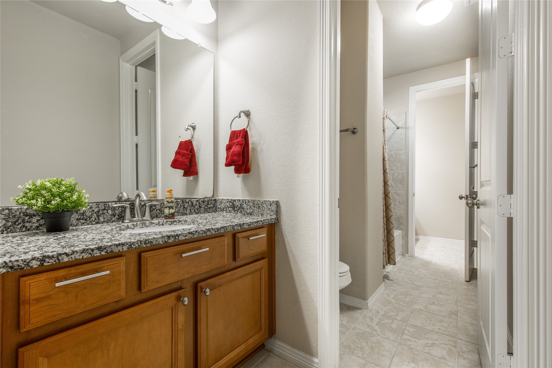 2607 Tree Swallow Bluff Path Spring, TX 77389 - Photo 32 of 50 a bathroom with cabinets sink and mirror