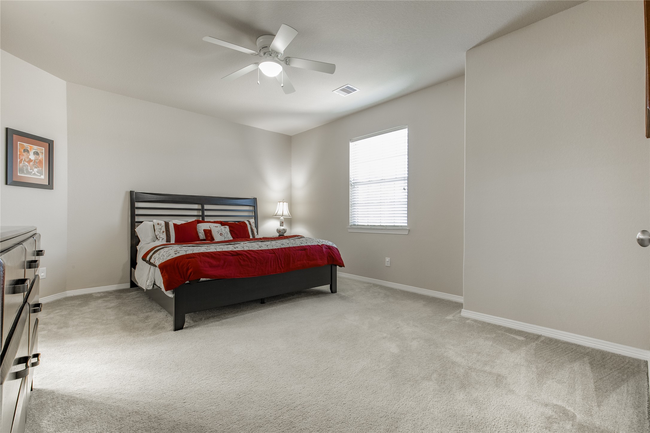 2607 Tree Swallow Bluff Path Spring, TX 77389 - Photo 34 of 50 a bedroom with a bed and window