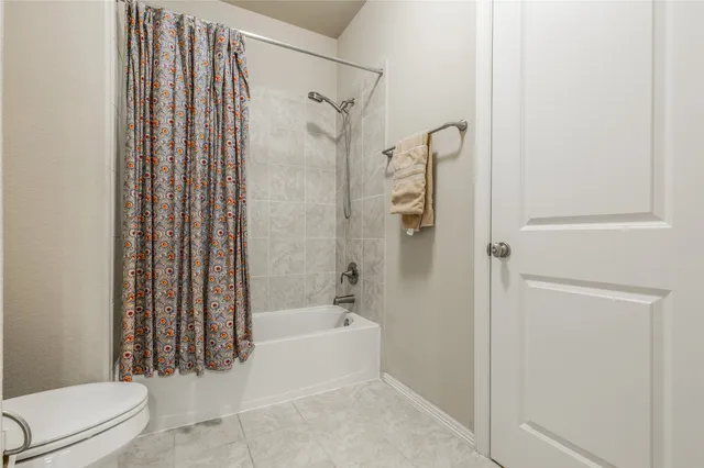 a bed room with a bed and a window