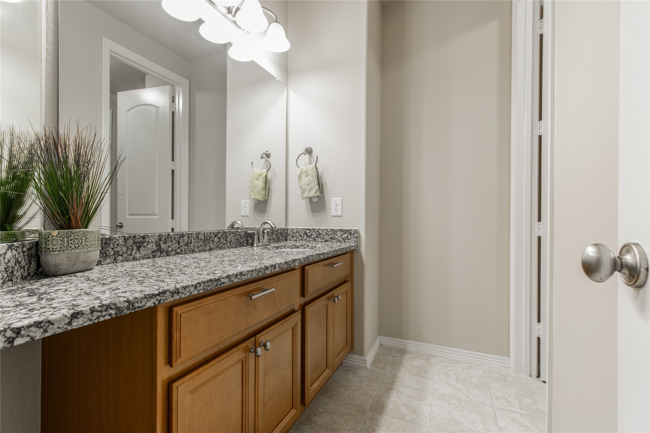 2607 Tree Swallow Bluff Path Spring, TX 77389 - Photo 36 of 50 a bathroom with a granite countertop sink and a mirror